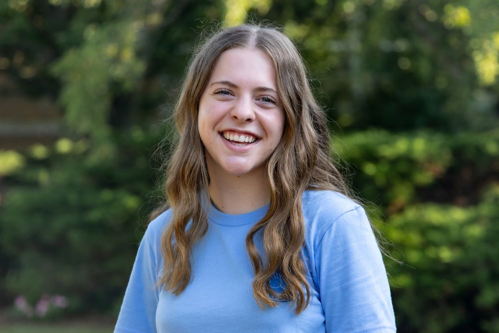 girl in blue shirt with brown hair