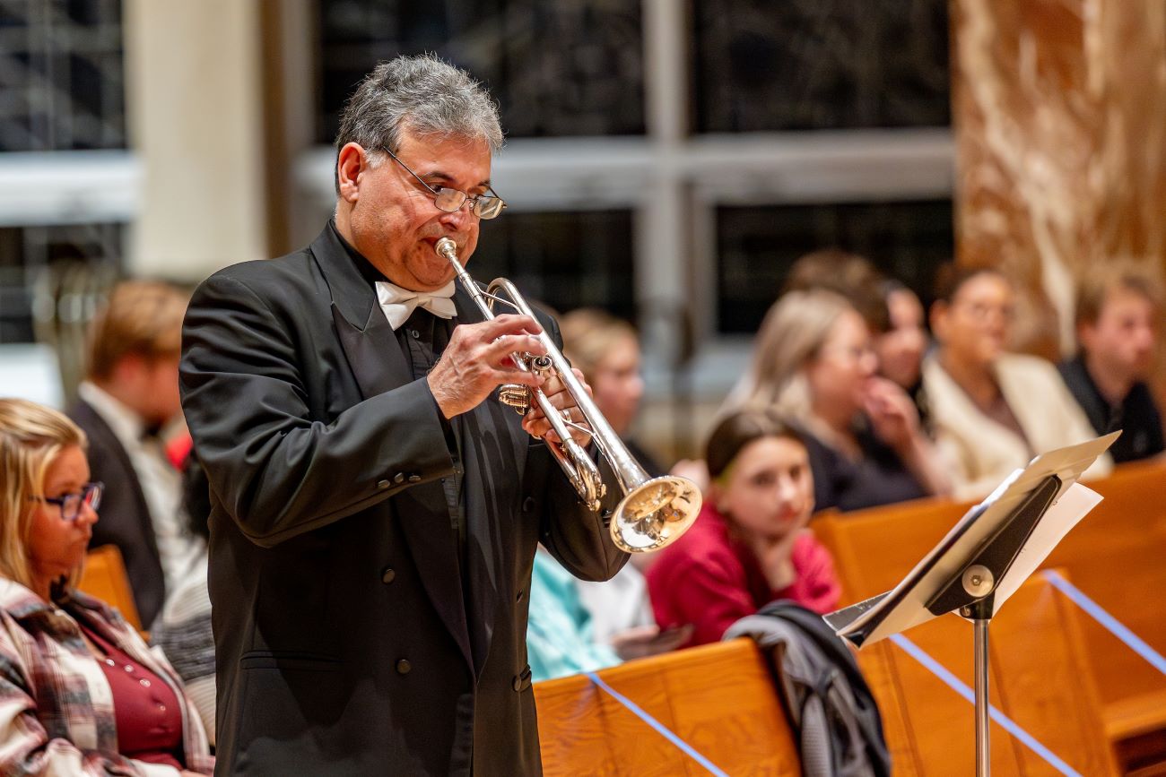 man playing instrument
