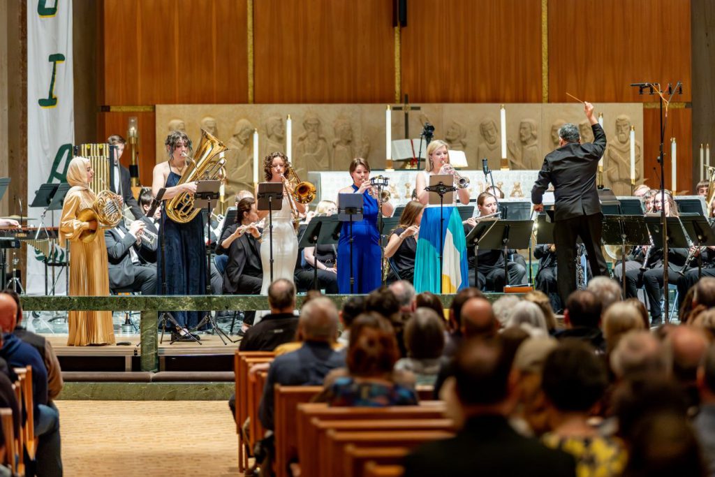 people performing in chapel