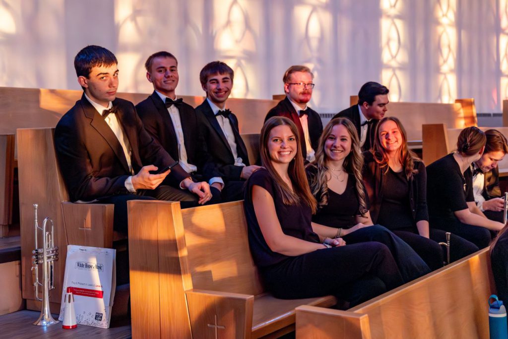 students sitting in pews