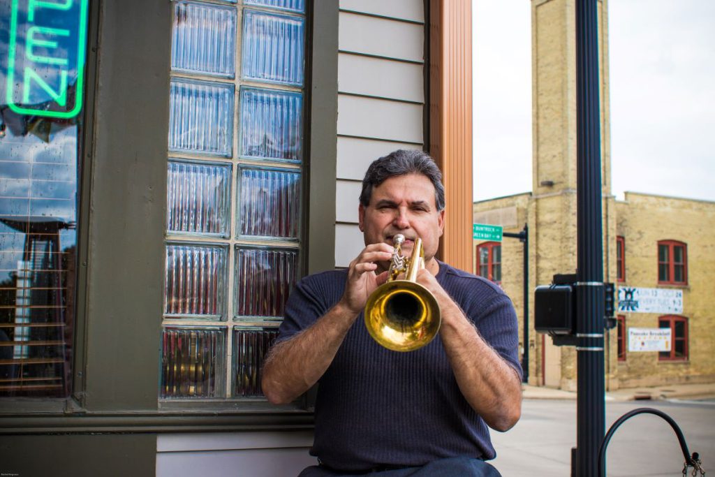 man playing instrument