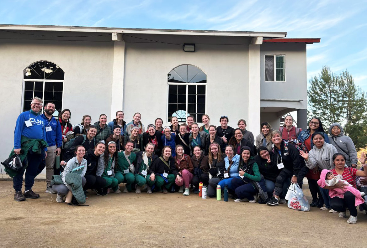 group photo in front of building
