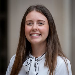 long brown hair and white blouse