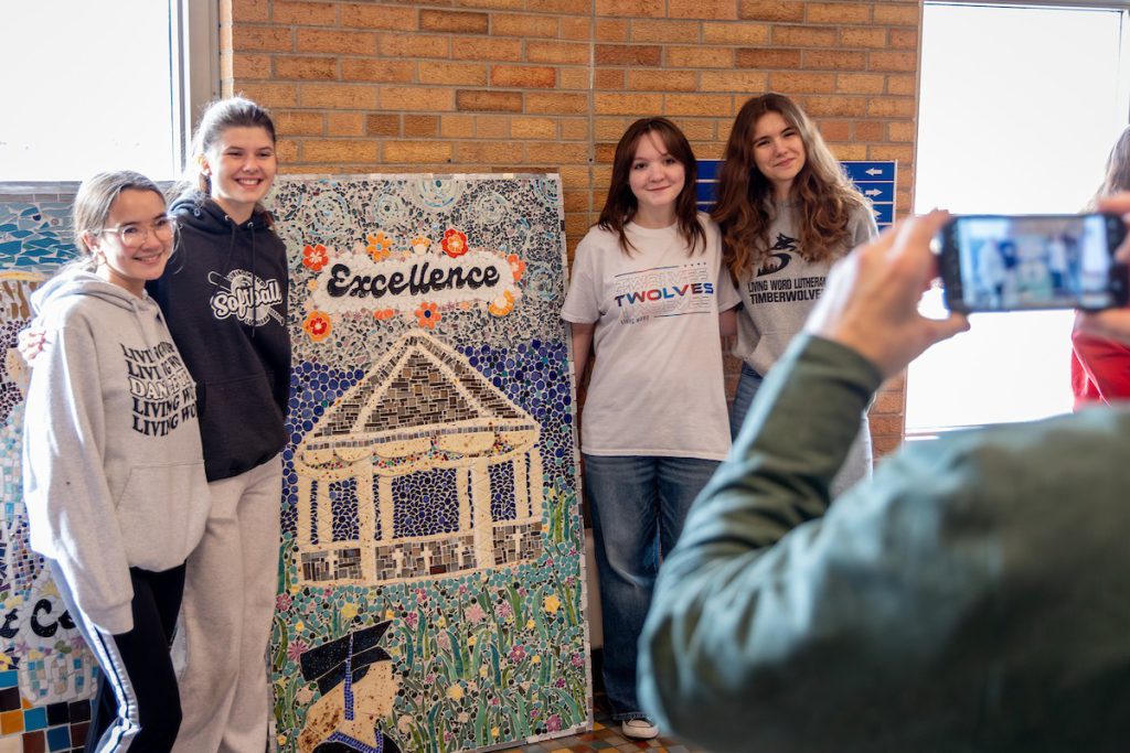 Students standing by art