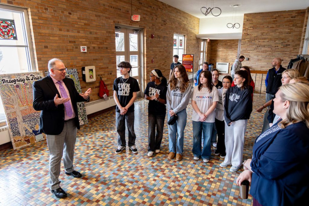Dr. Ankerberg talking to students