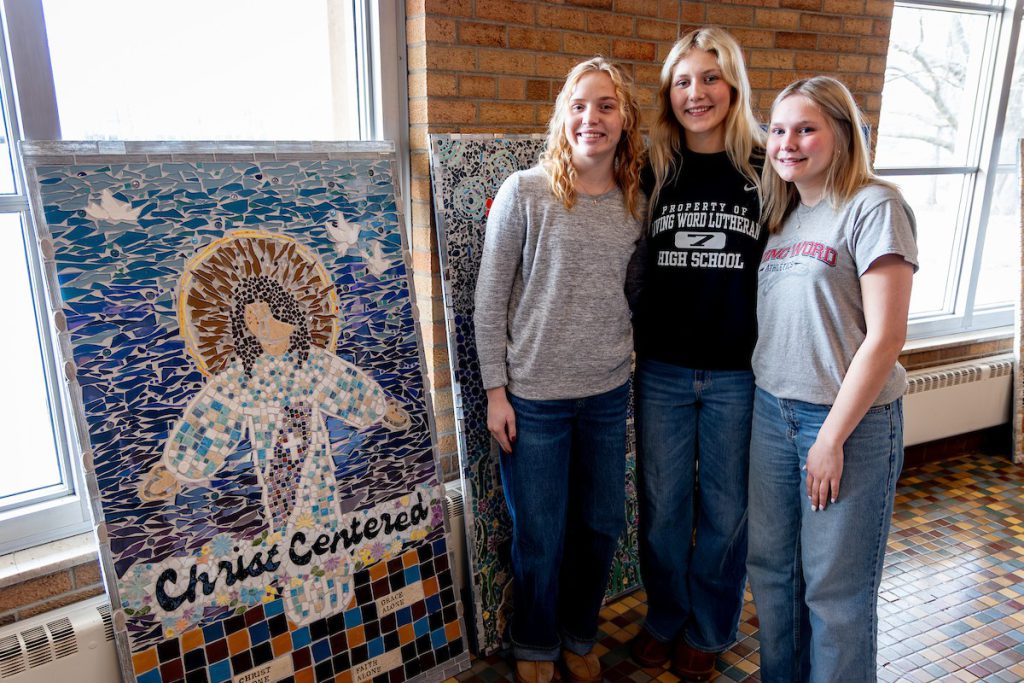 Students standing by art