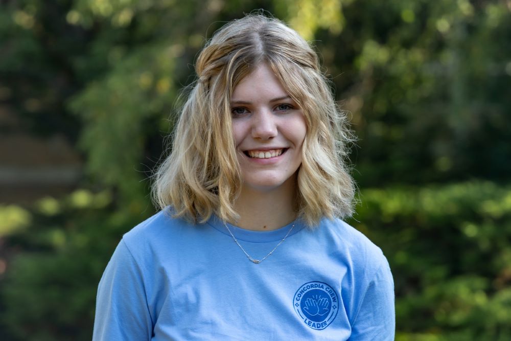 girl in blue shirt with blonde