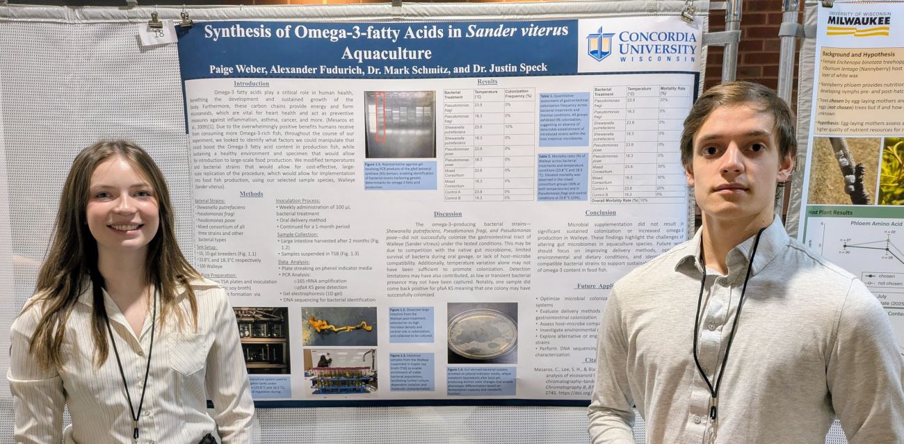 two students with science poster