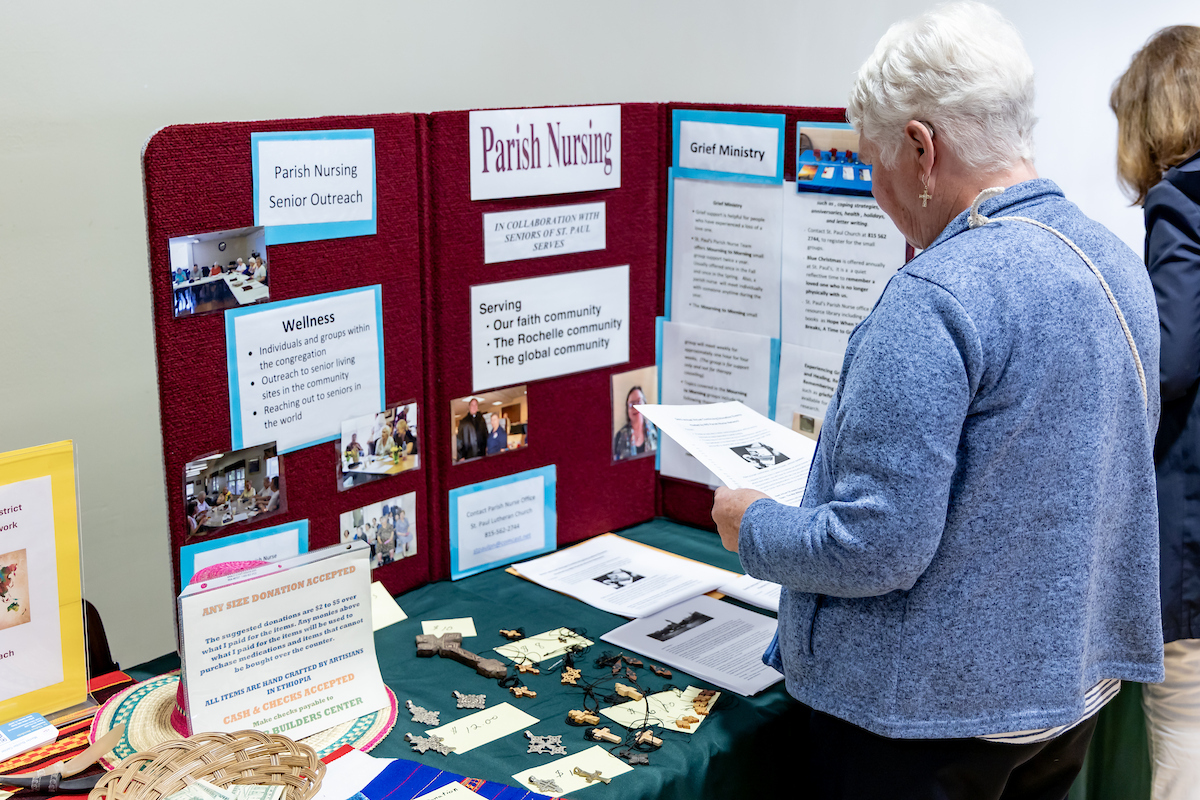 Woman looking at display at parish nurse conference