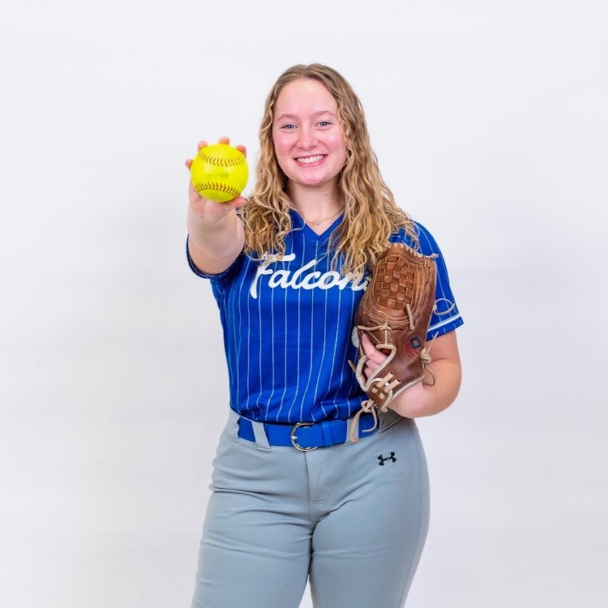 girl posing with Falcon shirt