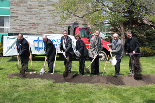 President Ferry leads administration in Pharmacy ground breaking.