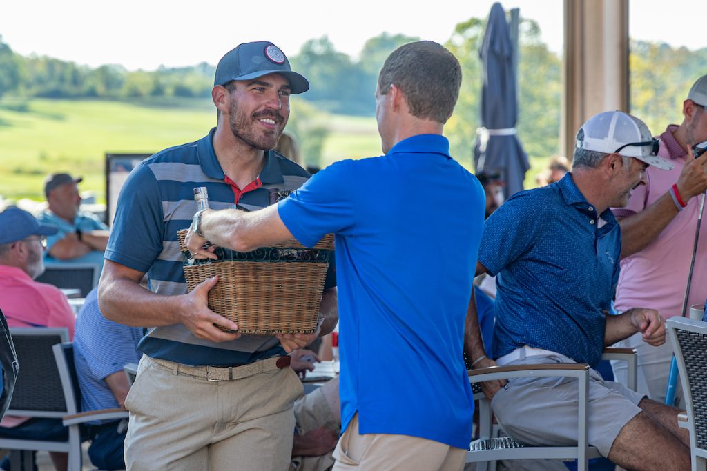 guy getting raffle basket