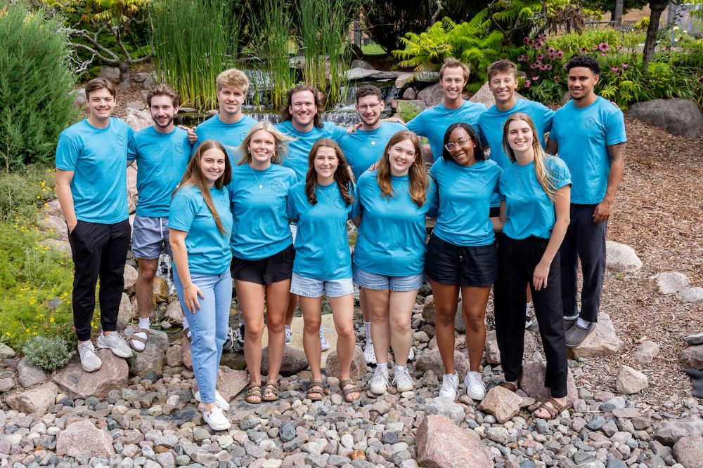 students in group with blue shirts