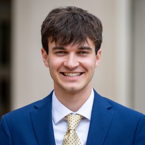 guy with blue suit and brown hair