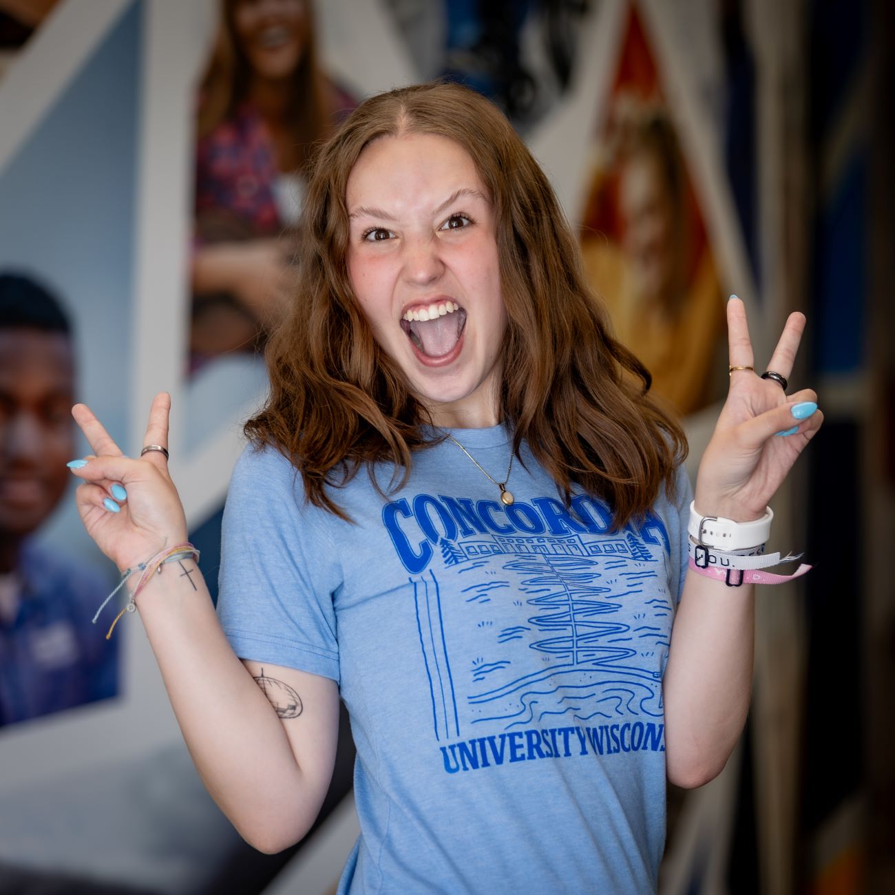 woman holding peace signs up 