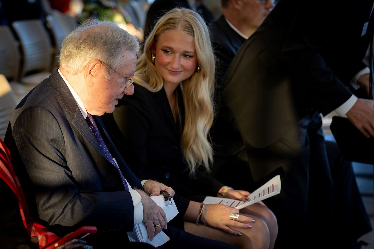 man with grey hair next to woman with long blonde hair
