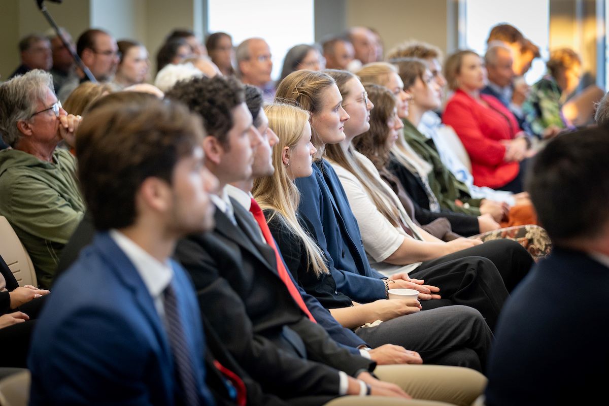 students and faculty sitting during a speaker