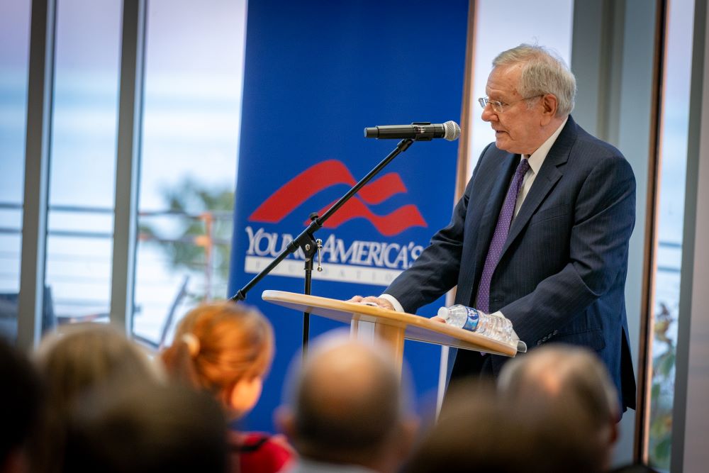closeup of man giving speech with glasses on