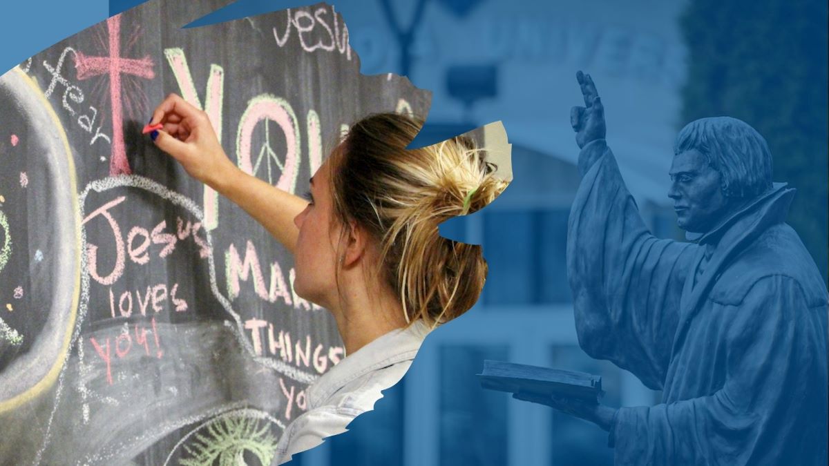 woman writing on chalk board and luther statue