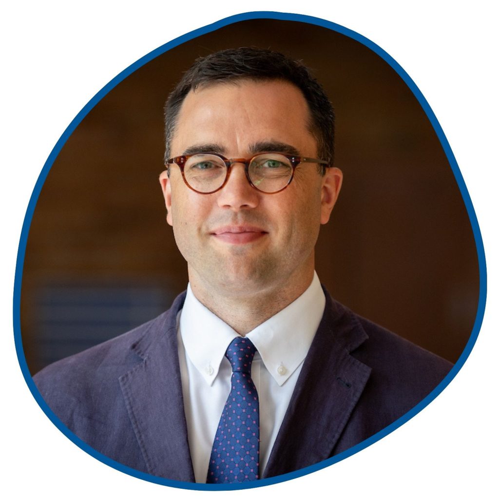 man with glasses and a suit