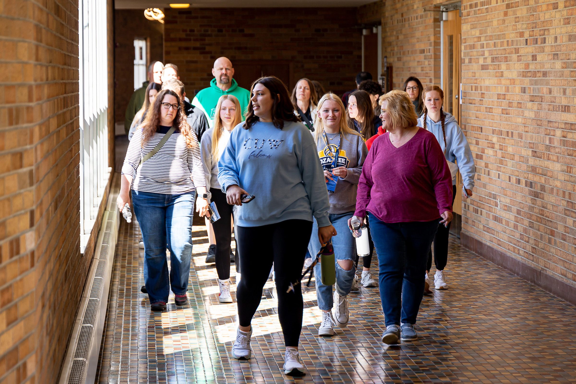 People walking in hallway 