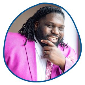 black man in pink suit