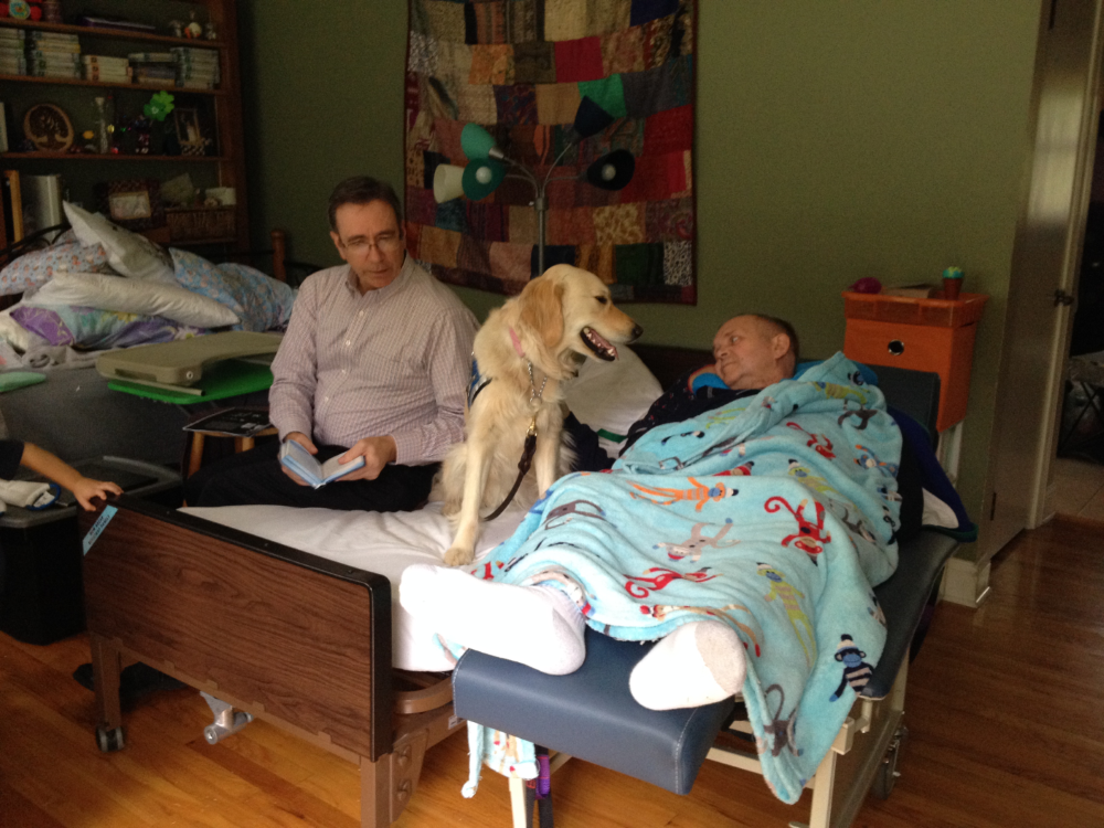 dog by person in bed
