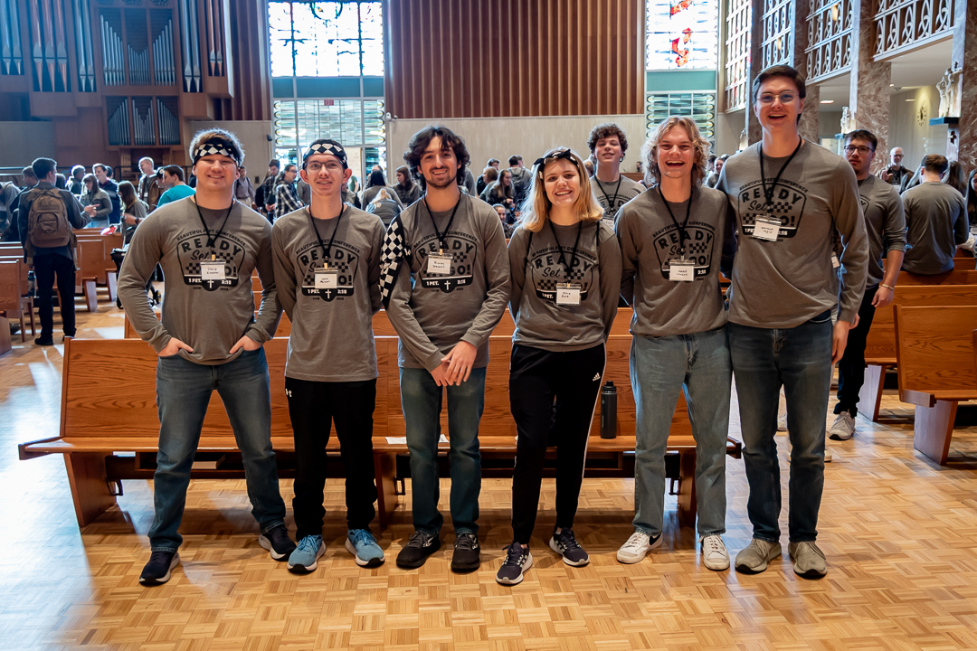 students standing together in chapel
