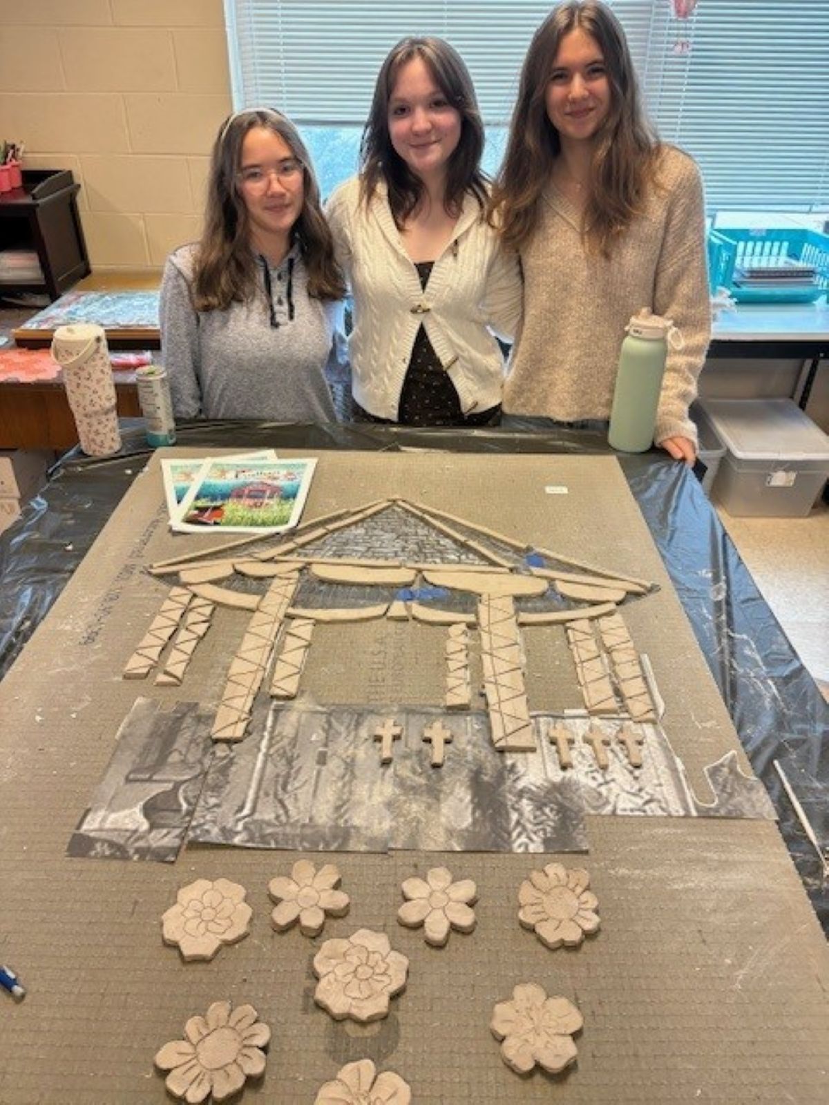 Students standing by art