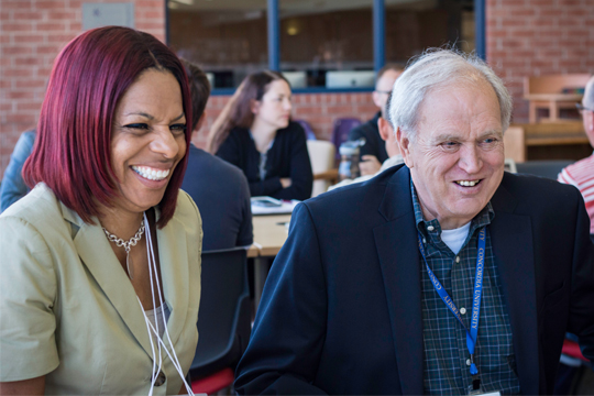 Dr. Elliott Moeser, Concordia professor and executive director of the CAGC, talks about school data with Monica Brown of the Brown Deer School District during a June equity institute.
