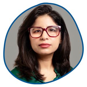 woman with brown hair and red glasses