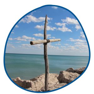 cross by beach in bubble