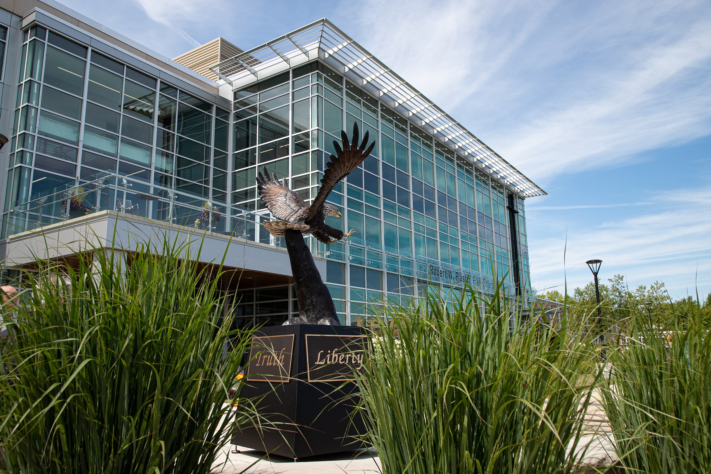 Photo of liberty statue in front of business building on campus.