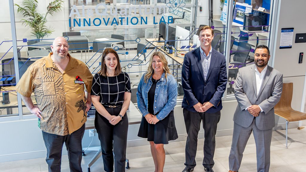 5 people, including Mike Litman standing in front of the Innovation Lab