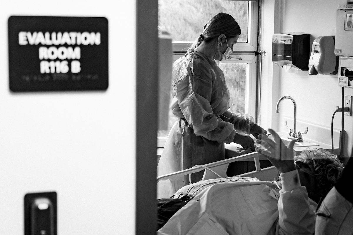 nurse by the bedside of a patient 
