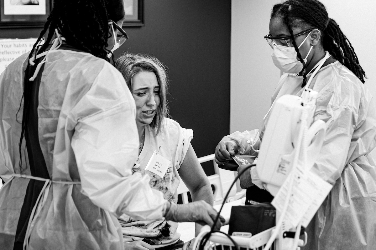 two nurses with patient