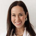 brown haired woman with big smile